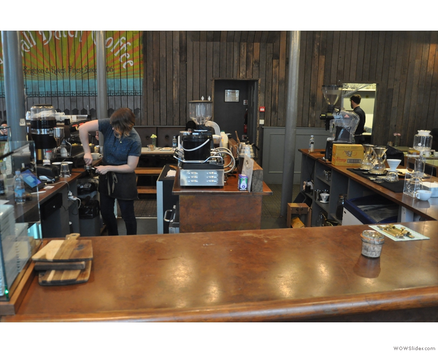 If you want to, sit at the end of the counter, with a view of both espresso machine & brew bar.