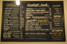 The menu is on a blackboard on the walll opposite the counter...