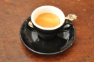 My lovely decaf espresso in a classic, black cup.