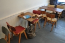 There's more seating opposite the counter, against the right-hand walll...