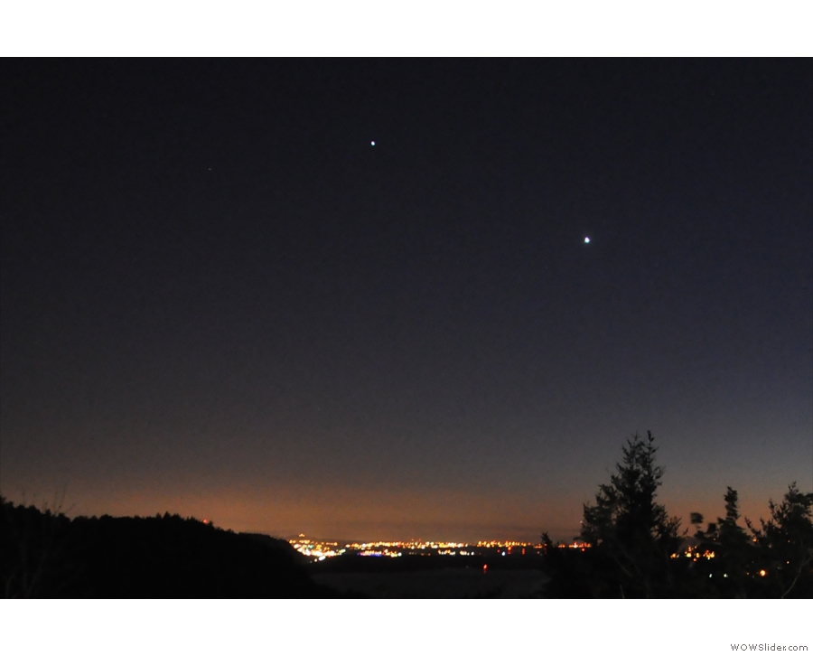 Both Venus and Jupiter were prominent on the horizon above the city's glow.