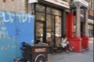 On the corner of Clinton and East Broadway, you'll find Pushcart Coffee, its location more than adequately sign-posted by the three-wheeled cart outside