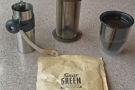 The perfect travel kit: a grinder, aeropress, UPPERCUP and some Dear Green beans.