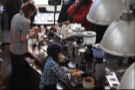 Barista at work: Marie-Eve puts the basket on the scales, zeroes them, then dispenses the coffee from the grinder into her hand before putting it into the basket to ensure the dose is at the precise weight