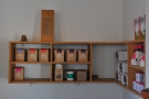 The nook holds Tandem's retail shelves. There are coffee beans for sale here...
