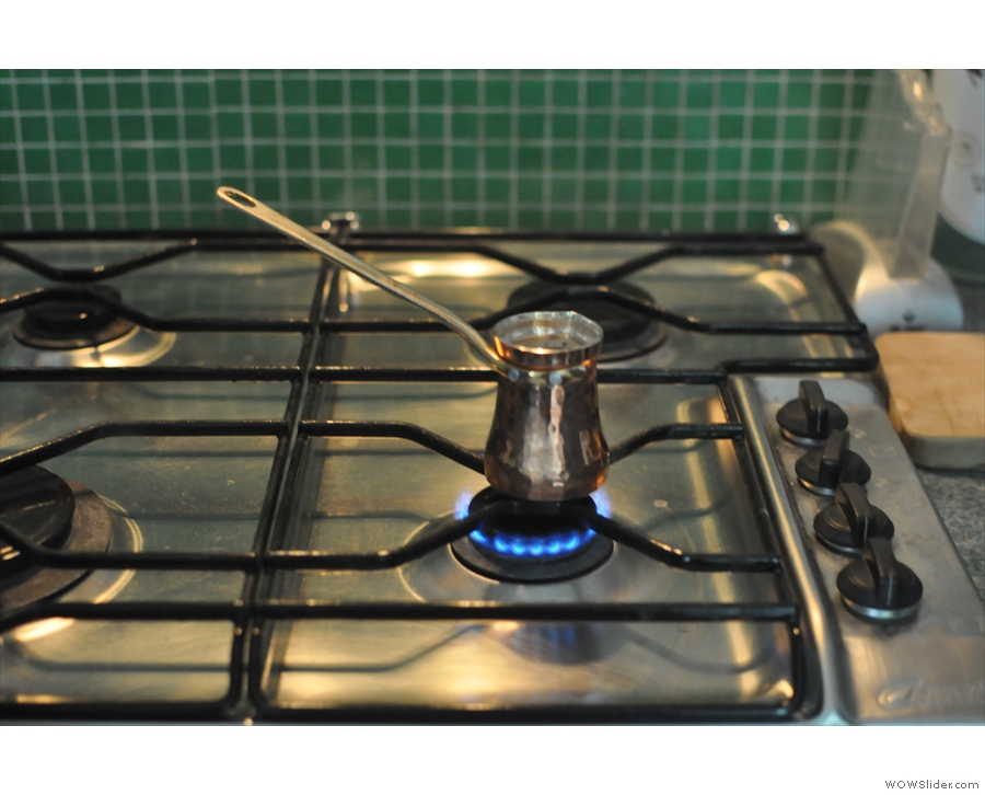 First place your cezve on a small gas burner over a low heat.