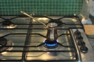 First place your cezve on a small gas burner over a low heat.