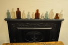 It's not just art: these bottles are on a shelf above the fireplace downstairs...