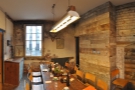 It's this lovely, wood- and brick-clad room, which can be used for meetings.