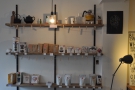 Plenty of coffee, tea and coffee/tea-making kit line the shelves behind the counter.