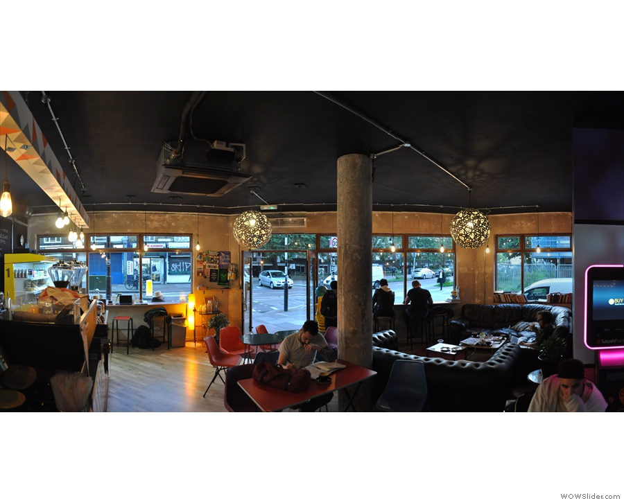 Finally, a panoramic view from the back, looking towards the windows/door at the front.