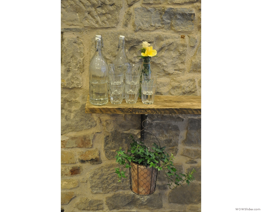 Although it's mostly stone and wood, the Milkman also has a lot of greenery and flowers.