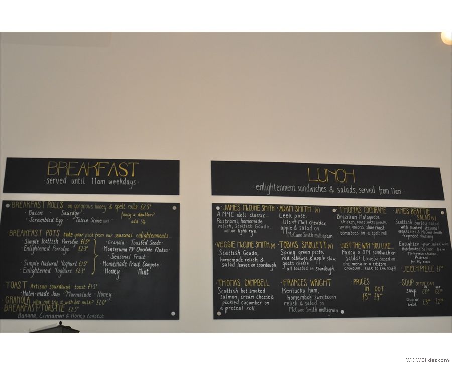The breakfast and lunch menus are on the wall behind the counter.