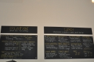 The breakfast and lunch menus are on the wall behind the counter.