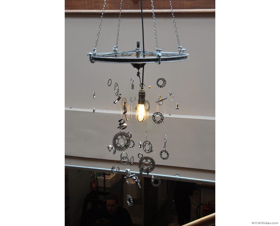 The gear-wheel mobile hanging around the solitary light-bulb is also an interesting feature.
