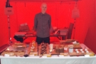 A proud owner and his slightly blurry cakes at the S'mores tent.