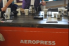 The barista at the Aeropress station gets to work