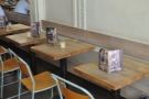 ... and tables opposite the counter.