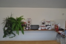 Various shelves carry various bits of coffee paraphernalia...