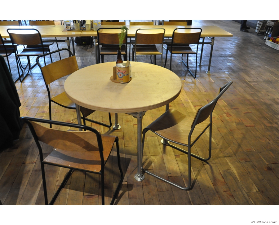 The seating's an interesting mix. Near the door, there are round tables like this one...