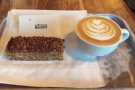 Of course, I couldn't resist. I had a slice of the seeded flapjack & a flat white...