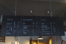 The menu hangs from the ceiling above the counter, just as it did back in 2012...