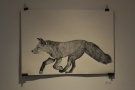 This running fox is from the Foxes Den upstairs. Like most of the art, it is for sale.