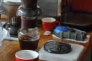 ... which then filters through the bottom. The coffee's served in a carafe, cup on the side.