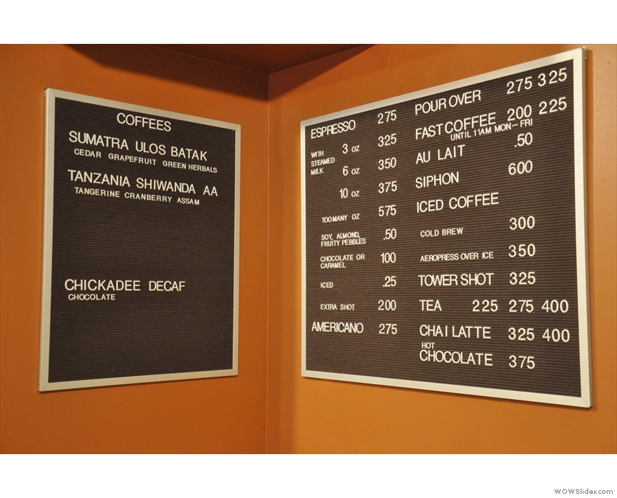 The coffee beans on offer are at the back, next to the concise drinks menu.