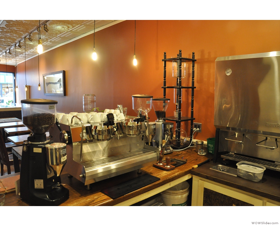 The two-group Synesso, with its grinders, plus the cold-brew apparatus, face the front...