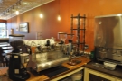 The two-group Synesso, with its grinders, plus the cold-brew apparatus, face the front...