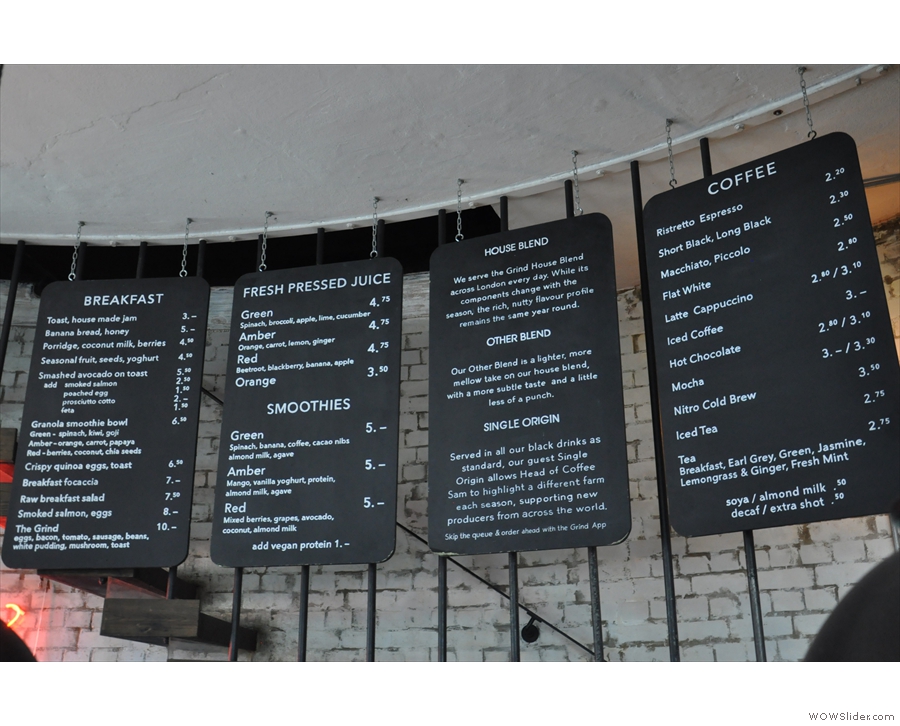 ... and hanging behind the counter. These are reversable: evening menus are on the back!