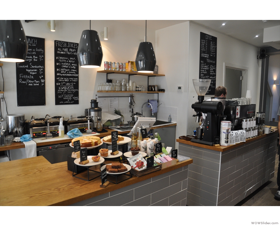 The counter is a two-part affair, food on the left, coffee on the right, menus on the wall.