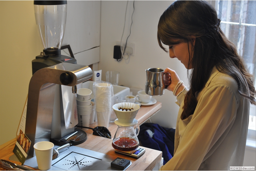 Not to be outdone, here is Ally at work at the Brew Bar. Once again, precision is everything, with the brew being weighed and timed to perfection.