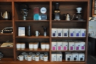 The coffee is part of a set of retail shelves, seen here along with coffee kit...