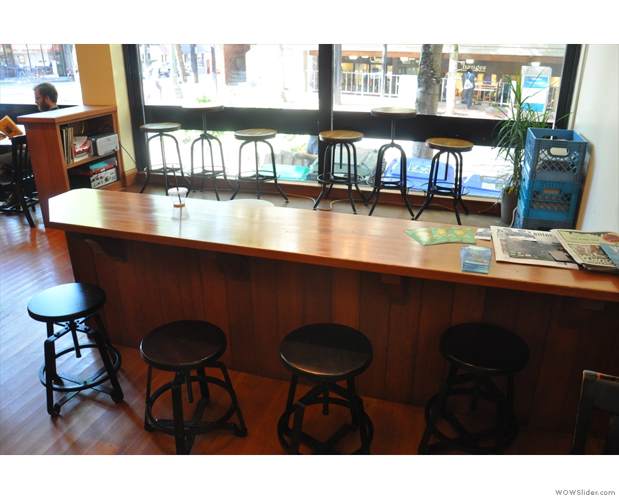... and a bar on the other side, which has stools on both sides.