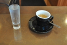 This is transfered to a classic black cup for drinking, served with a glass of sparkling water.