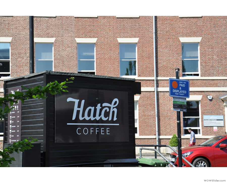 The small, black hut, once occupied by the car park attendent, is now home to Hatch Coffee.