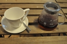 The coffee is served, as it should be, in a carafe, with a cup on the side.