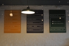 The coffee menus are on the wall to the right of the counter.